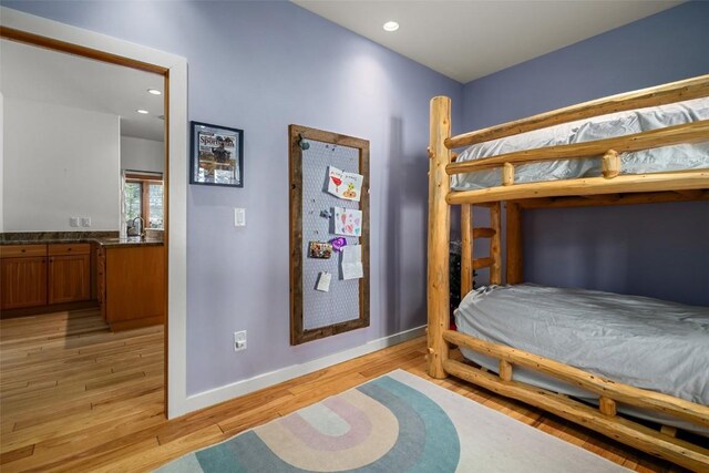 bedroom with light hardwood / wood-style flooring