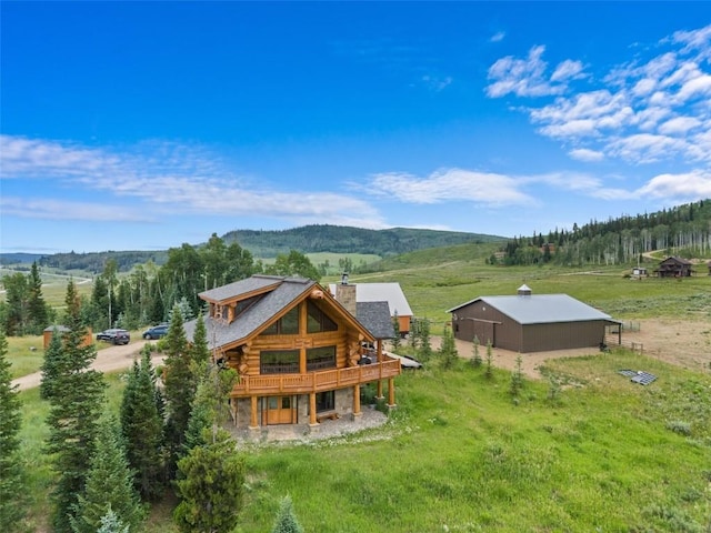 aerial view with a mountain view and a rural view