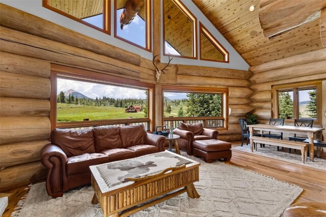 sunroom with wood ceiling and vaulted ceiling