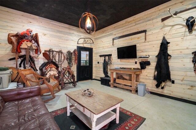 living room featuring wood walls