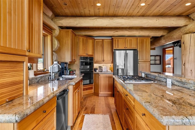 kitchen with light hardwood / wood-style floors, a kitchen island, wood ceiling, and appliances with stainless steel finishes