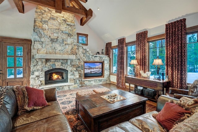 living room featuring beam ceiling, wood-type flooring, a fireplace, and high vaulted ceiling