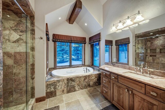 bathroom with vanity, shower with separate bathtub, and vaulted ceiling with beams