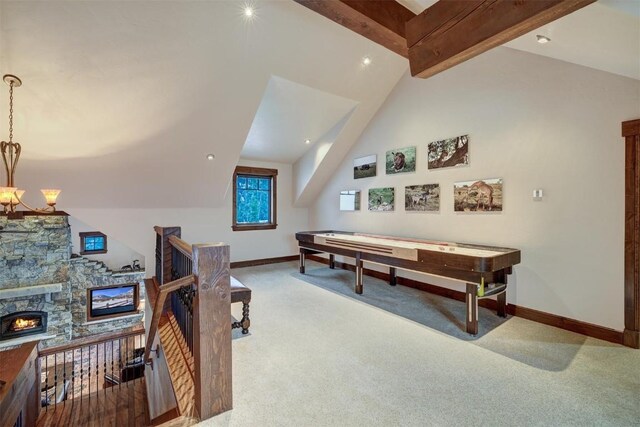 playroom featuring vaulted ceiling with beams, a fireplace, carpet floors, and an inviting chandelier