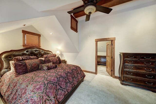 carpeted bedroom featuring ceiling fan and lofted ceiling