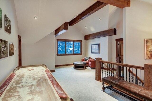 bedroom with carpet, beam ceiling, and high vaulted ceiling