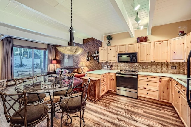 kitchen with electric stove, pendant lighting, backsplash, light brown cabinetry, and light wood-type flooring