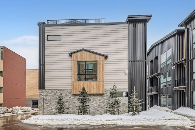 exterior space with stone siding