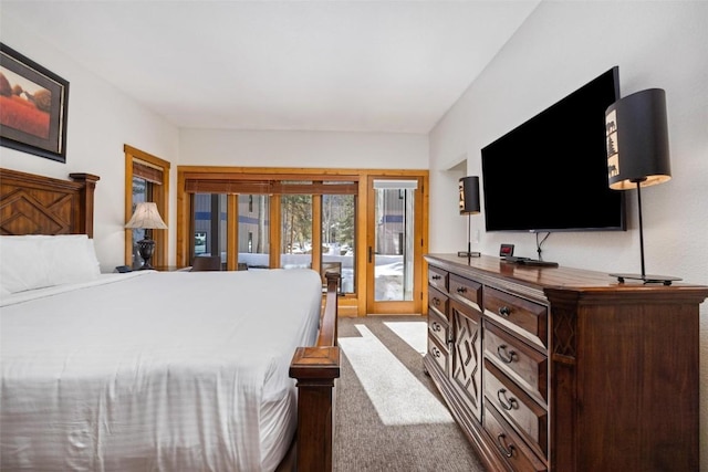 carpeted bedroom featuring access to outside