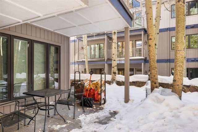 view of snow covered patio