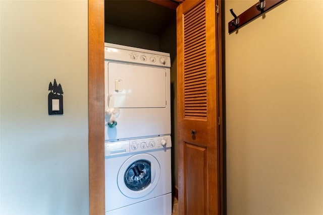 laundry area with stacked washer and clothes dryer