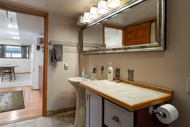 bathroom with tile patterned flooring