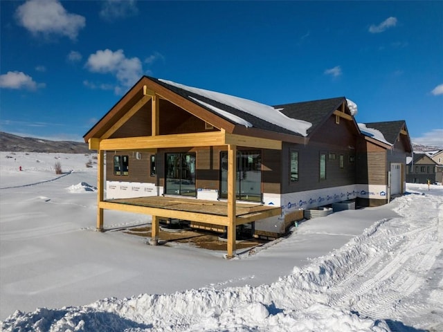 view of snow covered house