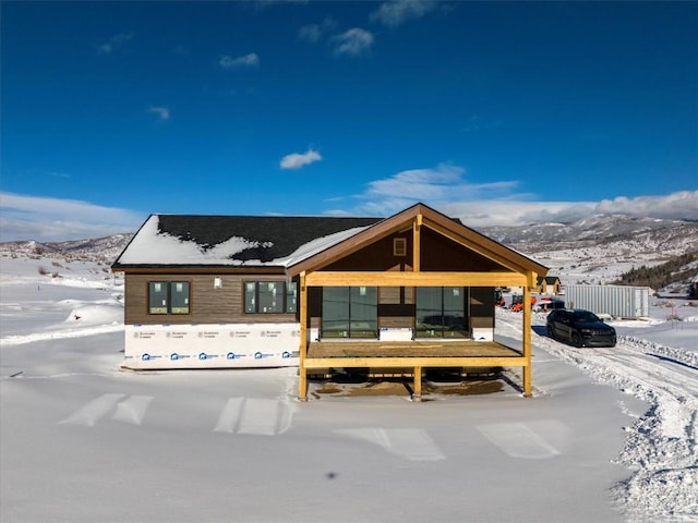 view of front of property with a mountain view