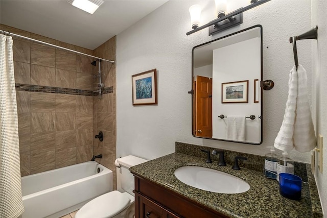 full bathroom featuring vanity, shower / bath combo, and toilet