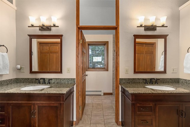 bathroom featuring vanity and a baseboard heating unit