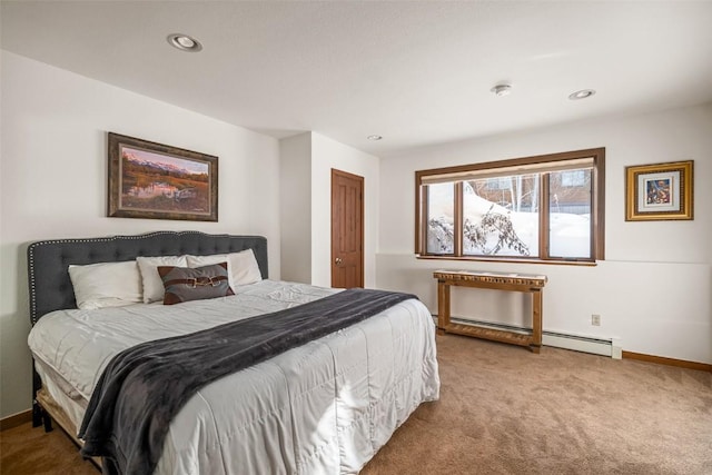 carpeted bedroom featuring baseboard heating