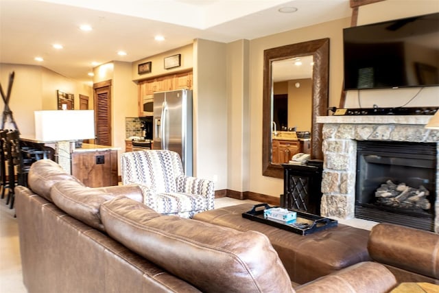 living room featuring a fireplace