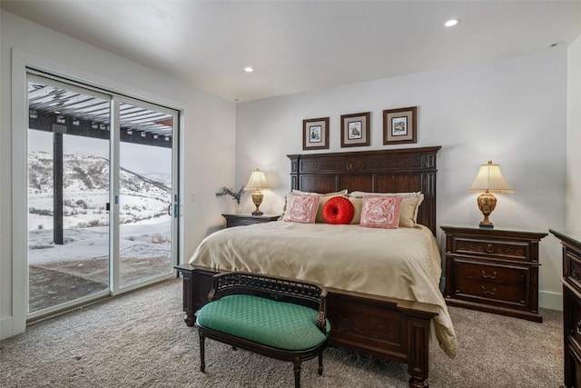 bedroom with access to exterior, recessed lighting, light carpet, and a mountain view