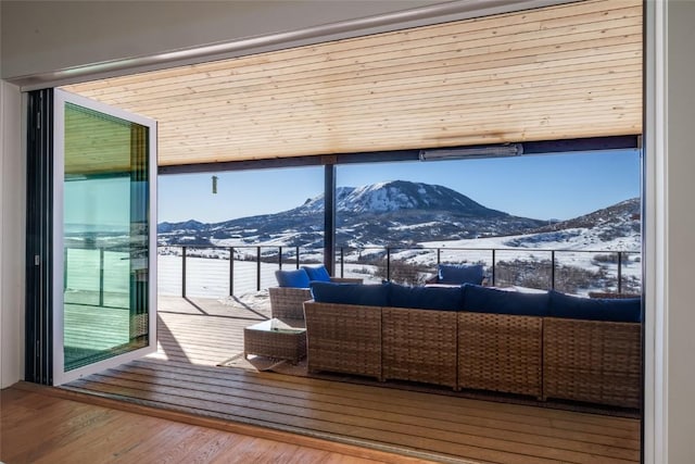 doorway featuring a mountain view and wood finished floors