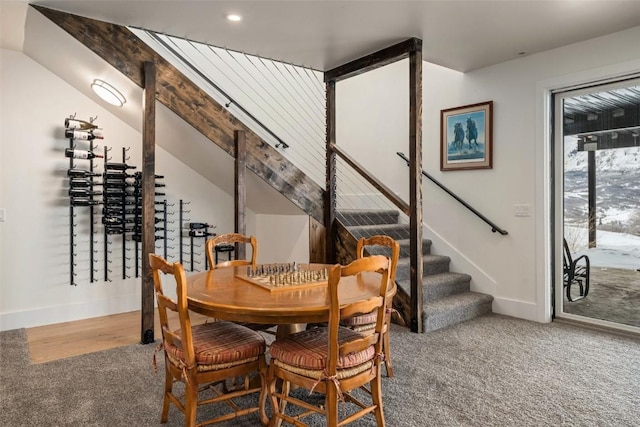 wine cellar with carpet flooring, vaulted ceiling, and baseboards