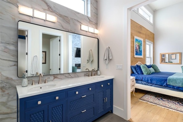 bathroom with plenty of natural light, hardwood / wood-style floors, and vanity