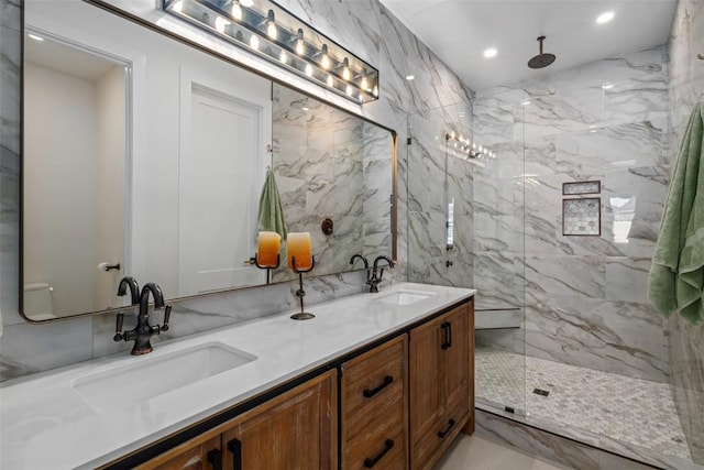 bathroom featuring vanity, tile walls, and a shower