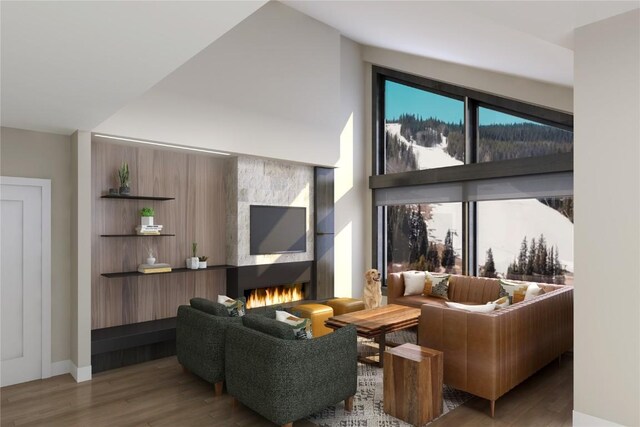 living room with wood-type flooring and vaulted ceiling