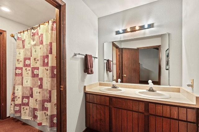 bathroom with a shower with curtain and vanity