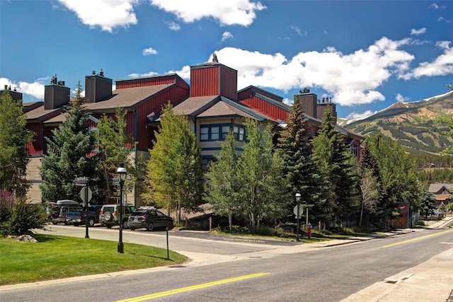 view of building exterior with a mountain view