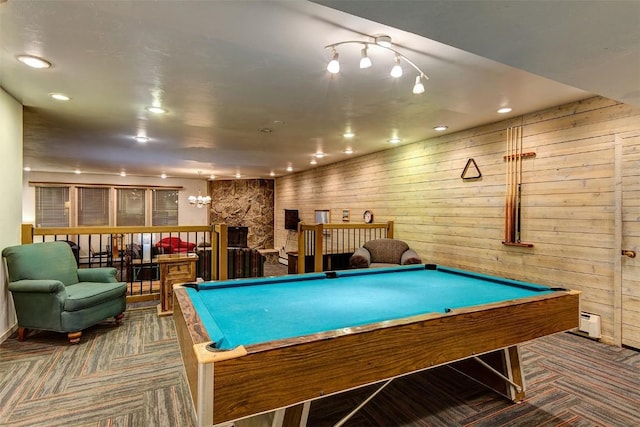 game room with carpet flooring, wood walls, baseboard heating, and billiards