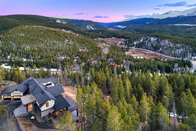 aerial view at dusk featuring a mountain view