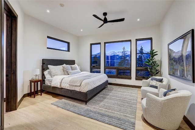 bedroom featuring ceiling fan and light hardwood / wood-style flooring