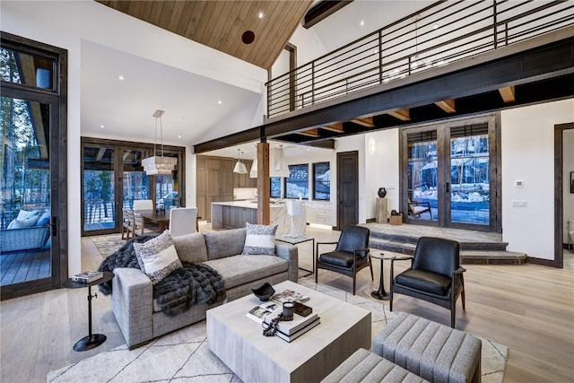 living room with french doors, high vaulted ceiling, light hardwood / wood-style flooring, and wood ceiling