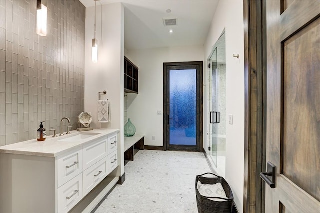 bathroom with vanity and an enclosed shower