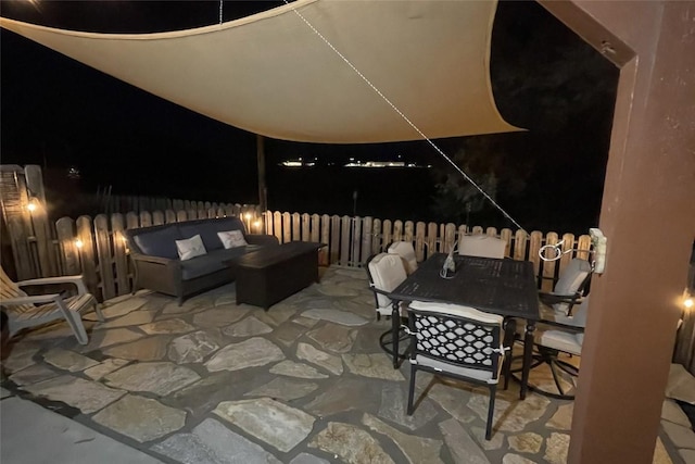 patio at twilight with an outdoor living space