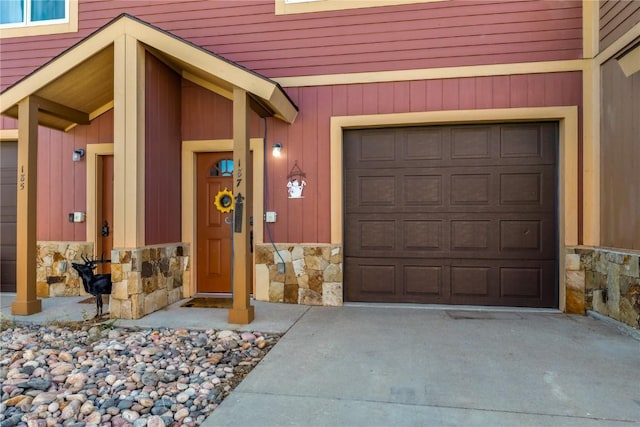 doorway to property featuring a garage