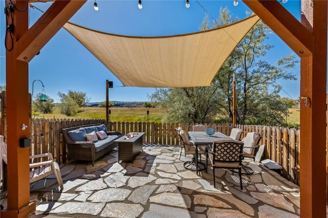 view of patio / terrace featuring an outdoor living space with a fire pit