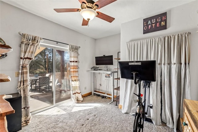 workout room with light carpet and ceiling fan