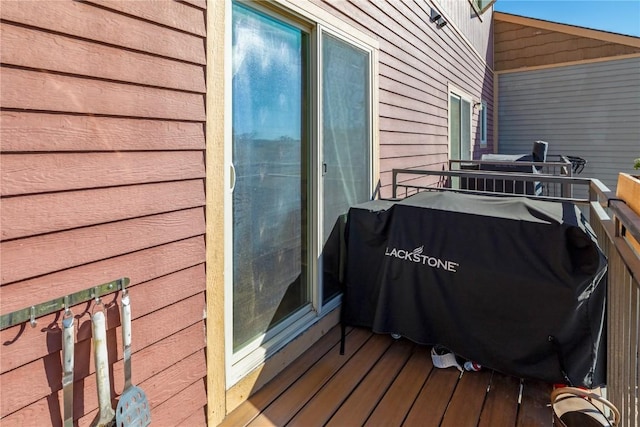 wooden deck featuring grilling area