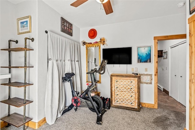 exercise area with carpet flooring, a baseboard radiator, and ceiling fan