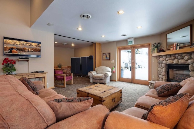 living room featuring french doors, carpet, and a fireplace