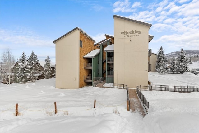 view of snow covered house