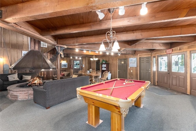 rec room with beam ceiling, billiards, wooden walls, and wooden ceiling