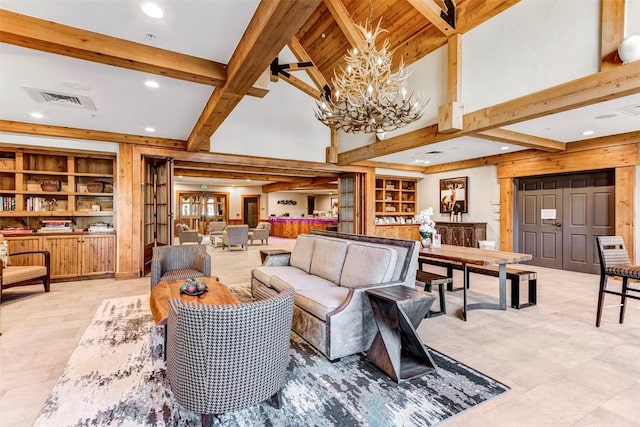 living area featuring an inviting chandelier, a high ceiling, visible vents, and beamed ceiling