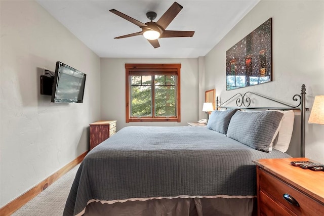 bedroom featuring a ceiling fan and baseboards