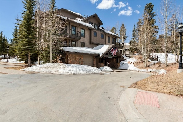 view of front of property with a garage and stairs