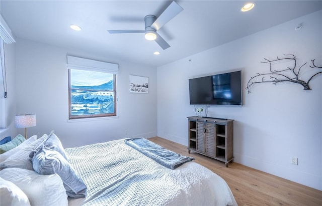 bedroom featuring ceiling fan and light wood-type flooring