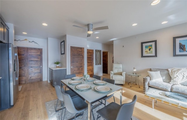 dining area featuring light hardwood / wood-style floors and ceiling fan