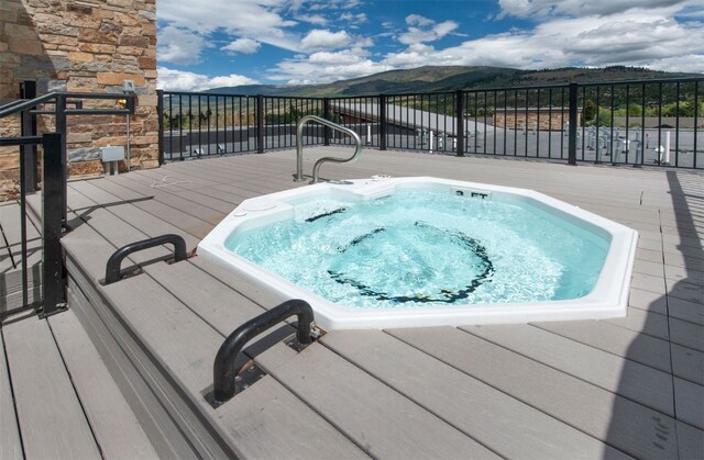 view of swimming pool with a mountain view